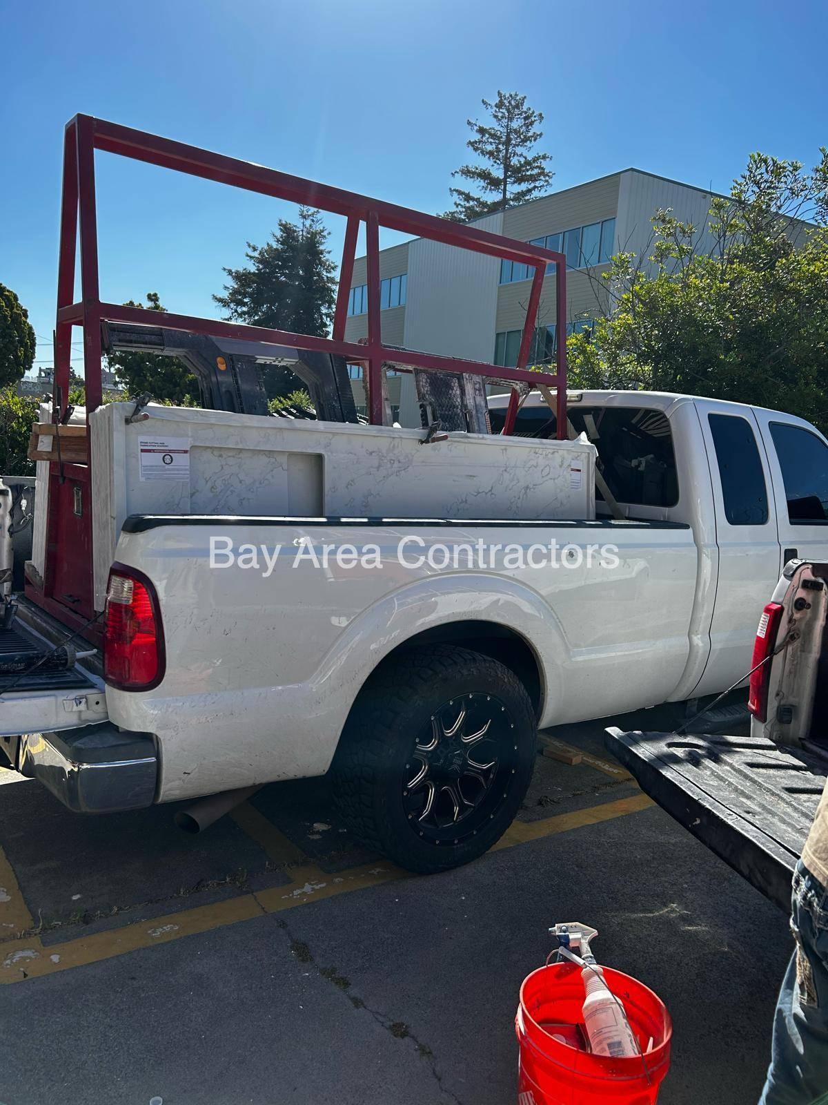Quartz countertop slabs racked on a pickup for delivery to a renovation site